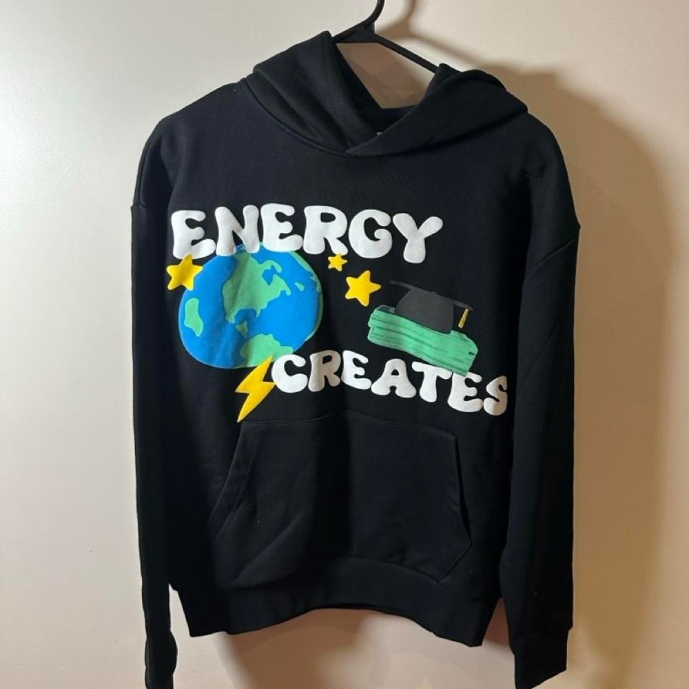 Black hoodie with white text reading 'ENERGY CREATES' with a blue globe
